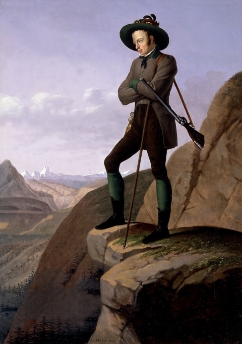 Eine Ölgemälde vom Erzherzog Johann, er steht auf einem Berg und schaut nach unten. Er hat Tracht an und um seine Schulter hängt ein langes Gewehr.